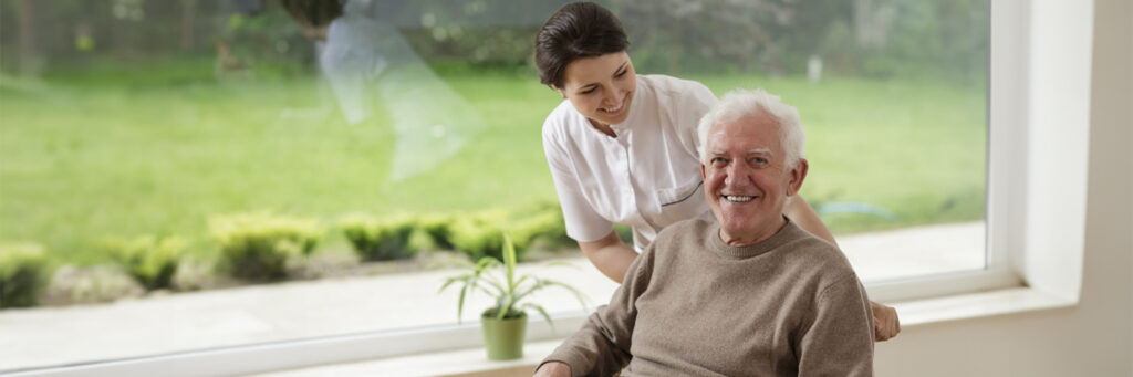 Caregiver with elderly gentleman